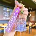 Cartoon purple sand castle acrylic keychain with silicone wristband and golden bell charm - Purple Luminous Bubble Bead Castle