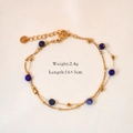Detail of double-layer stainless steel gold bracelet with faceted blue beads and tiny cubes - Lapis Lazuli Bracelet
