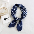 Navy blue silk scarf with white polka dots tied in a knot on minimalist background - Navy Blue Double Row Dot Frame
