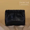 Small black quilted makeup bag with gold lettering on elegant champagne satin fabric - Small / Classic Black