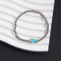 Stainless steel beaded bracelet featuring a bright blue fish charm and silver beads - Blue Fish Style (NS10-3)
