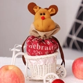 Christmas reindeer drawstring gift bag with Celebrate text inside a white woven basket - Christmas Reindeer Apple Bag