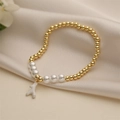 Elegante pulsera de cuentas doradas y perlas con colgante de coral blanco en seda - Blanco
