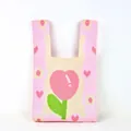 Close-up of thick knitted cotton bucket bag featuring pink tulip and daisy floral patterns - Pink Cartoon Tulip