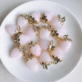 Detail of glittery pink resin strawberry charms with gold leaf accents on a ceramic plate - 6# Glossy Pink