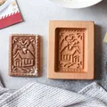 Rectangular beechwood cookie mold featuring an intricate house design with chimney engraving - House