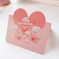 Detail view of pink Valentine's Day card with 3D heart-shaped wings and envelope - Wing Envelope