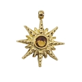 Detail of 14k gold star pendant featuring a centered amber zircon with textured finish - Champagne Rhinestone
