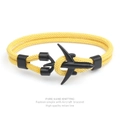 Detail of hand-knitted yellow Milan rope bracelet featuring a matte black airplane clasp - Yellow Rope Black Airplane