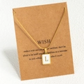 Golden snake chain necklace featuring a square pendant with letter L on a gift card - L / Gold