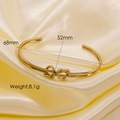 Minimalist twisted gold titanium steel open bangle with dimensions 68mm by 52mm - 8011-Knot Open Cuff Style