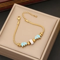 Detail of gold snake chain bracelet featuring light blue elephant enamel and crystal beads - Light Blue Elephant Enamel and Pave Crystal Beads (4#)