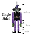 Decorazione strega Halloween monofacciale con gonna viola e viso verde 48cm - Strega Monofacciale