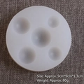 Detailed view of round silicone mold with various sizes of hemispherical cavities - 50-318-D/Round 5-Hole Hemisphere / White