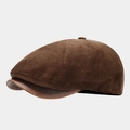 Detailed side view of a vintage brown corduroy newsboy cap with a contrast leather brim - One Size / Coffee