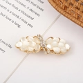 Detail of golden bow hair clip with opal stones and sparkling crystal rhinestones - Style 6 Small Bow Tie