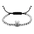 Adjustable stainless steel bead bracelet with crystal crown charm on white background - Silver