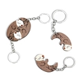 Pair of wooden otter keychains for couples that fit together in a heart shape - Wooden Otter