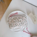 Detailed view of pink floral quilted cotton pouch with zipper and simple wish label - Nude Pink Tiny Floral