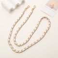 Detail of gold metal and white leather woven chain strap with spring lobster clasps - White Leather Interwoven Chain