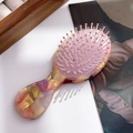 French vintage acetate hair comb with amber tortoise pattern and pink air cushion - Dazzling Yellow Purple