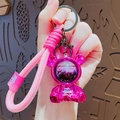 Portachiavi a forma di orso spaziale con sabbia mobile viola e cinturino intrecciato rosa - Rosa Rossa