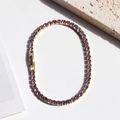 Tennis bracelet in gold finish featuring elegant purple cubic zirconia stones - Gold Color - Purple Zircon