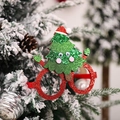 Occhiali di Natale rossi glitterati con albero di paillettes su un albero di festa decorato - Stile Albero di Natale