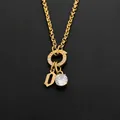 Élégant collier en acier inoxydable or 14K avec cristal brillant et pendentif lettre D - Lettre O