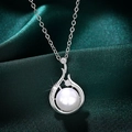 Elegant silver pendant with round white pearl and sparkling crystals on green silk - Necklace / White Gold Color (XL633)