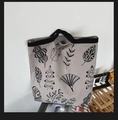 Canvas tote bag with black leaf patterns and sturdy woven handles for daily use - Grey Leaf