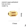 Détail macro d'une perle en cuivre doré avec zircon rouge et mesures 17mm x 9mm - Perle Cylindrique Zircone Rouge(P03694)