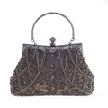 Dettaglio borsa da sera vintage con ricami di perline e manico in metallo decorato - Grigio Minerale