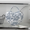 Quilted heart-shaped cosmetics bag with blue floral patterns and top handle - Dark Blue Floral