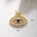 Macro detail of Evil Eye pendant in gold with blue stone, measuring 12mm by 9mm - A0066 Mini Blue Eye