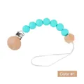 Silicone and beech wood pacifier clip with teal beads and geometric bead in color 1 - Style 1