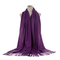 Detail view of deep purple cashmere scarf with soft fringes and authentic fabric label - Dark Purple