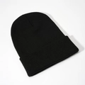 Detailed close-up of the knitted texture and cuffed hem on a classic black beanie hat - Black