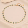 Detail of heart-shaped blue gems on a gold necklace with adjustable lobster clasp closure - 2# Lake Blue