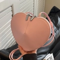Pink heart-shaped crossbody bag made of premium PU leather with double zipper detail - Pink