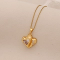 Close-up of golden heart pendant necklace with a large clear gem and small crystal accents - 4# White