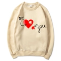 Apricot crewneck sweatshirt with heart puzzle print in a flat lay display - Khaki (Pattern 2)