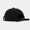 Detail of black cotton docker cap with N embroidery and vintage metal buckle strap - Black