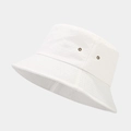 Detail view of white canvas bucket hat featuring metallic eyelets and reinforced stitching - One Size / White