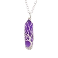 Detailed view of amethyst hexagonal crystal necklace with silver tree of life wire wrapping - Amethyst