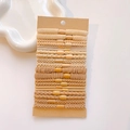 Close-up of earth-toned hair tie set including ribbed and braided elastic ponytail holders - Off White Khaki Combination Set