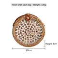 Handmade round woven straw crossbody bag with heart-shaped shell inlay detail - Heart Shell