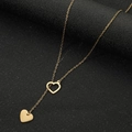 Minimalistische gouden roestvrijstalen ketting met dubbele hartjes en een elegante kwastje - Goud