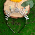 Handmade iridescent crystal crown with silver pentagram on forest moss background - Aurora Crystal Pentagram Style