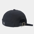 Detail of vintage canvas docker hat featuring 'N' embroidery and bronze metal buckle - Black